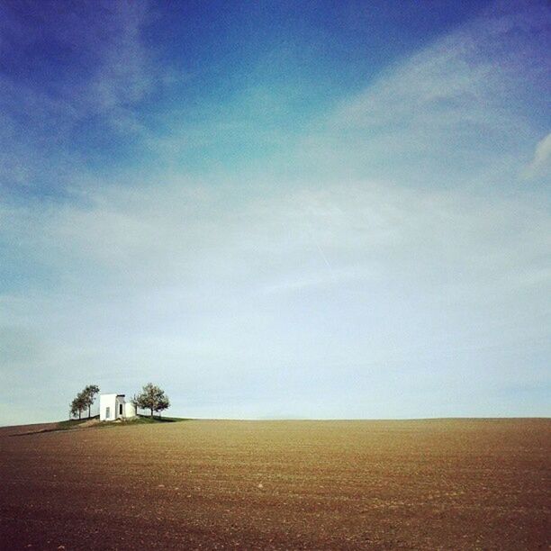 VIEW OF LANDSCAPE AGAINST BLUE SKY