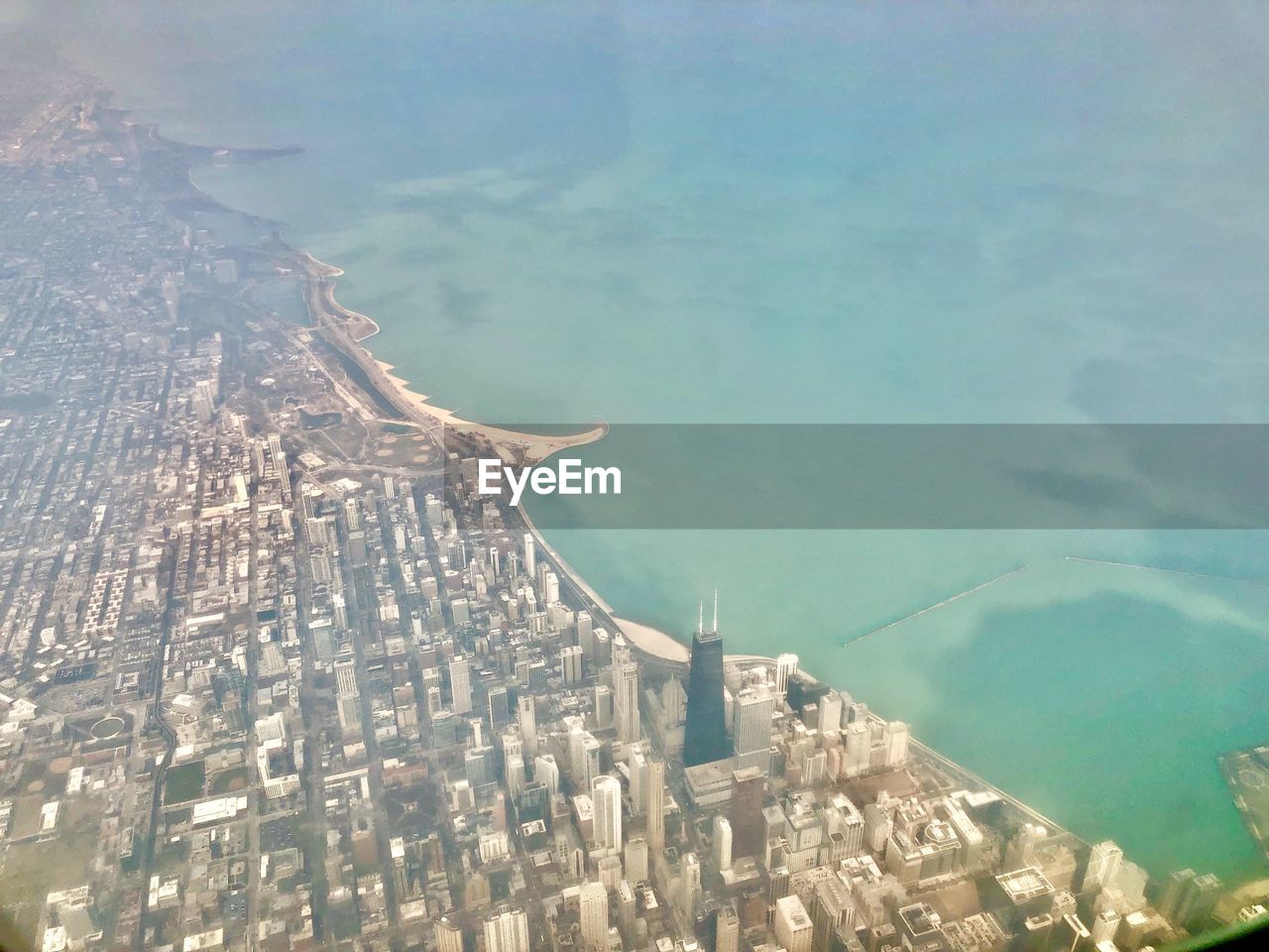 HIGH ANGLE VIEW OF BUILDINGS AND SEA