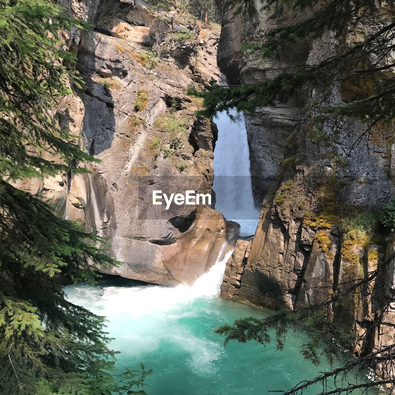 SCENIC VIEW OF ROCK FORMATIONS IN WATER