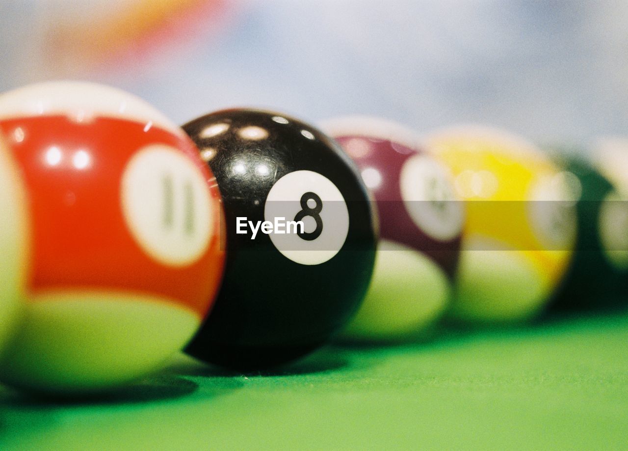 Close-up of colorful balls on pool table