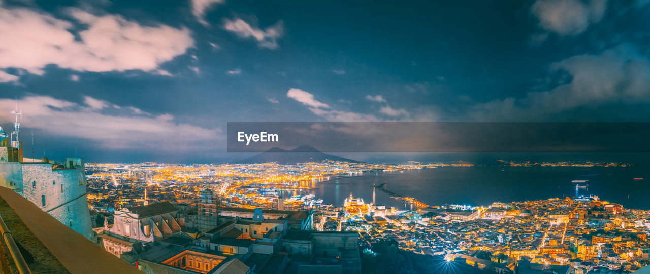 Aerial view of illuminated building in city