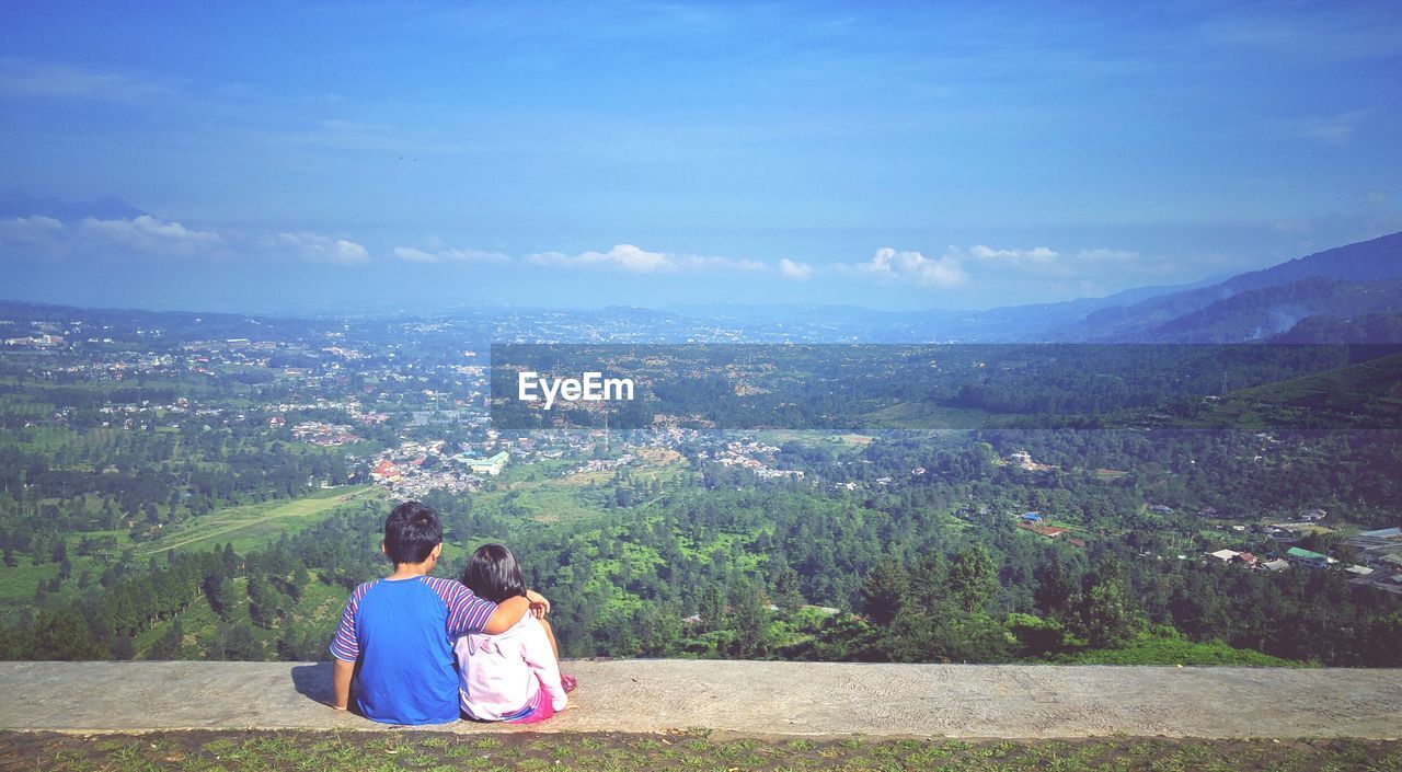 Scenic view of landscape against cloudy sky