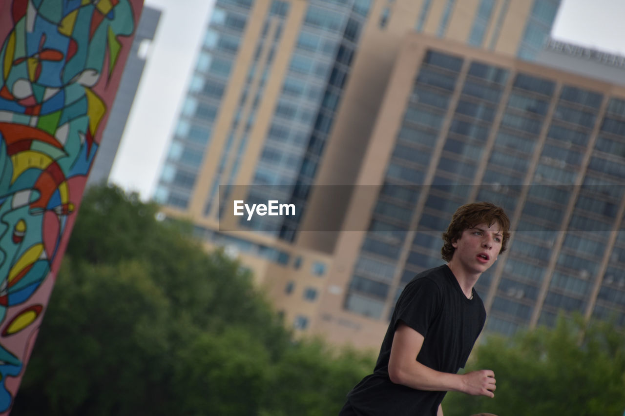 Portrait of teen boy downtown 