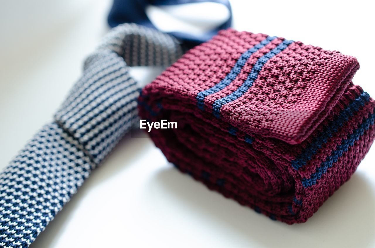 Close-up of necktie with sock on table