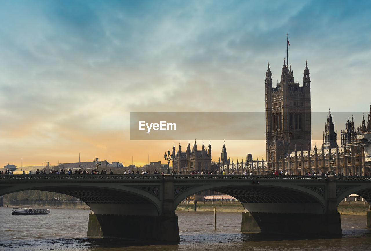 BRIDGE OVER RIVER AND BUILDINGS IN CITY