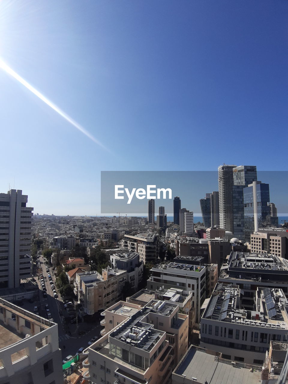 HIGH ANGLE VIEW OF BUILDINGS IN CITY AGAINST SKY