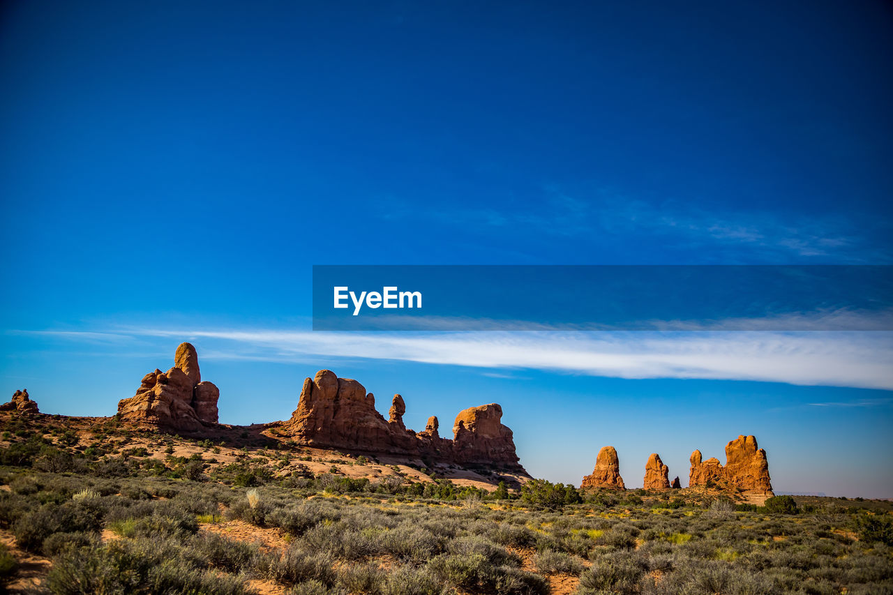 Rock formations against blue sky