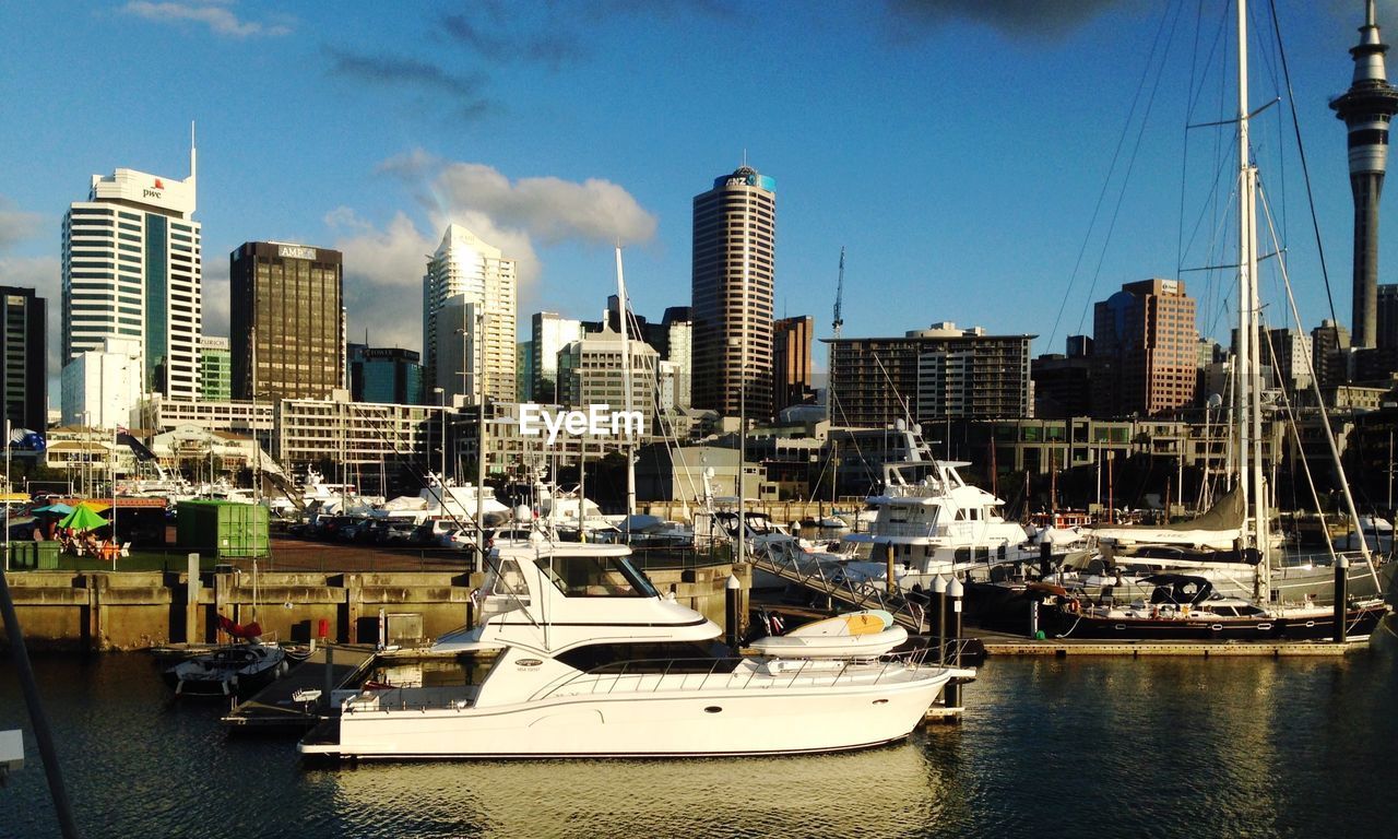 City buildings and boats at harbor