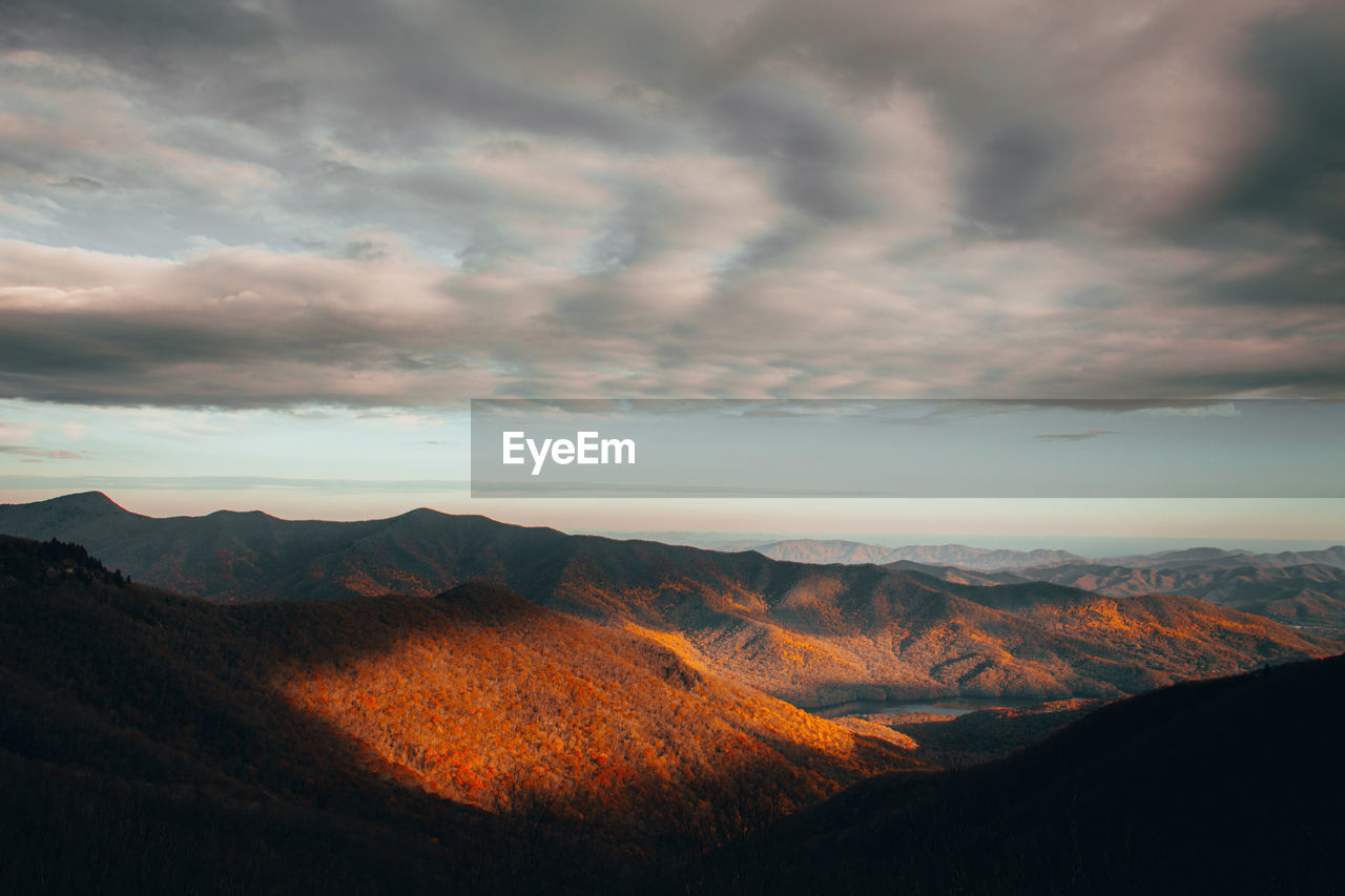 SCENIC VIEW OF MOUNTAINS DURING SUNSET