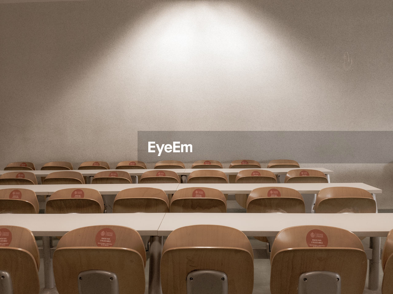 Empty classroom. seats against wall.