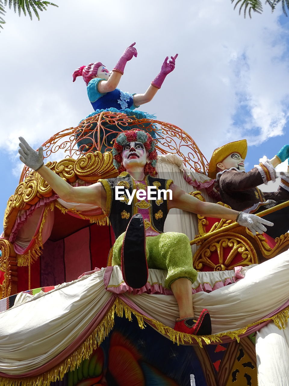 LOW ANGLE VIEW OF CAROUSEL AT AMUSEMENT PARK