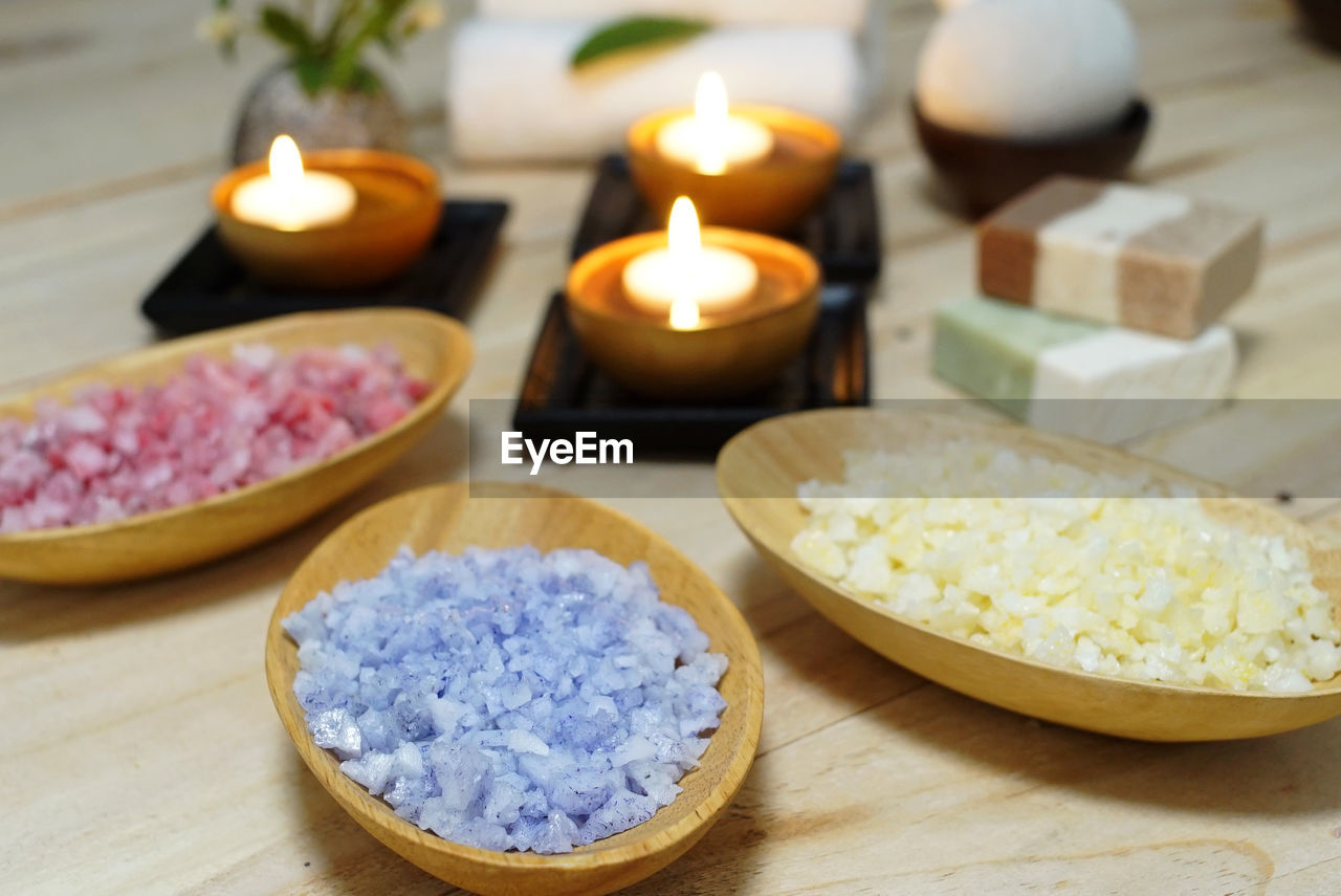 HIGH ANGLE VIEW OF TEA WITH CANDLES ON TABLE