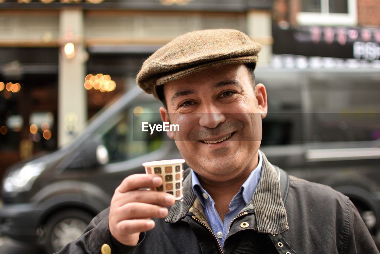 Portrait of smiling man in city