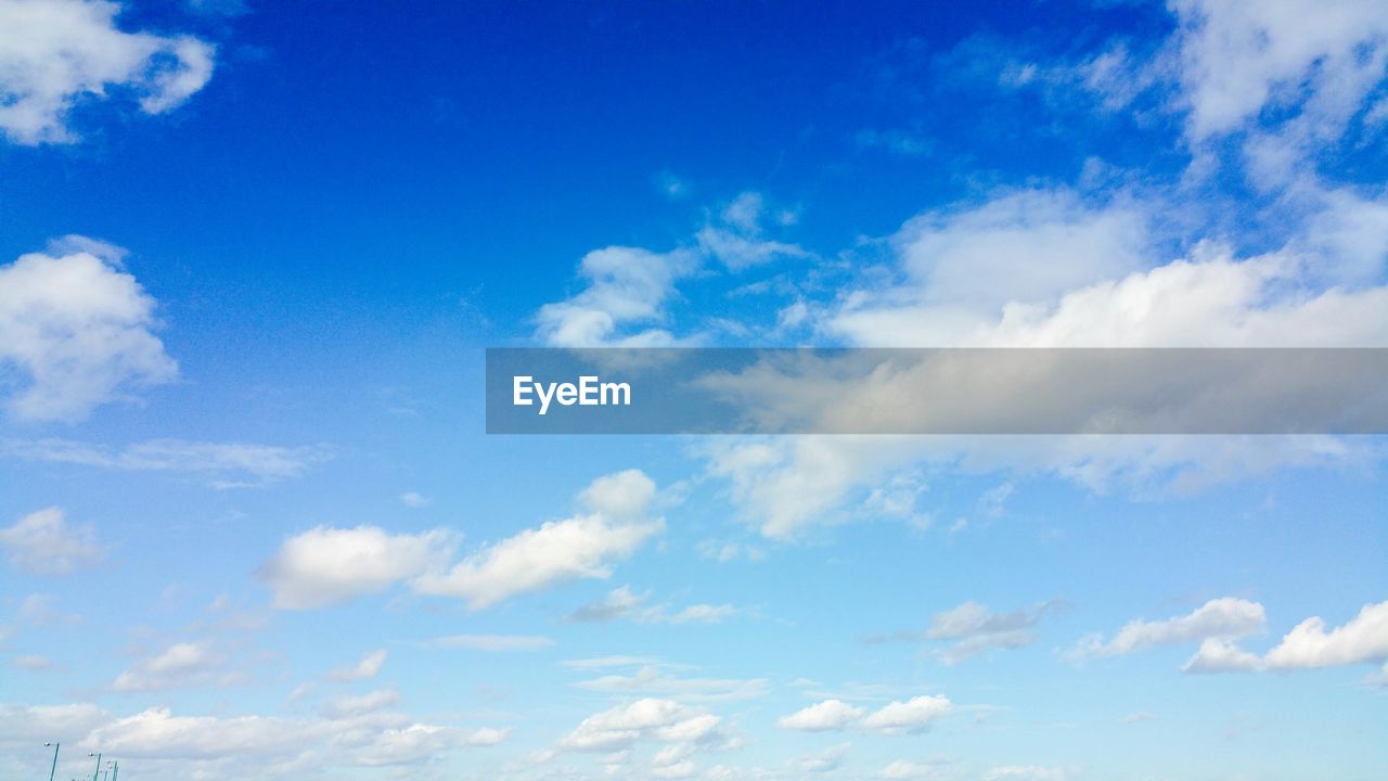 Low angle view of blue sky and clouds