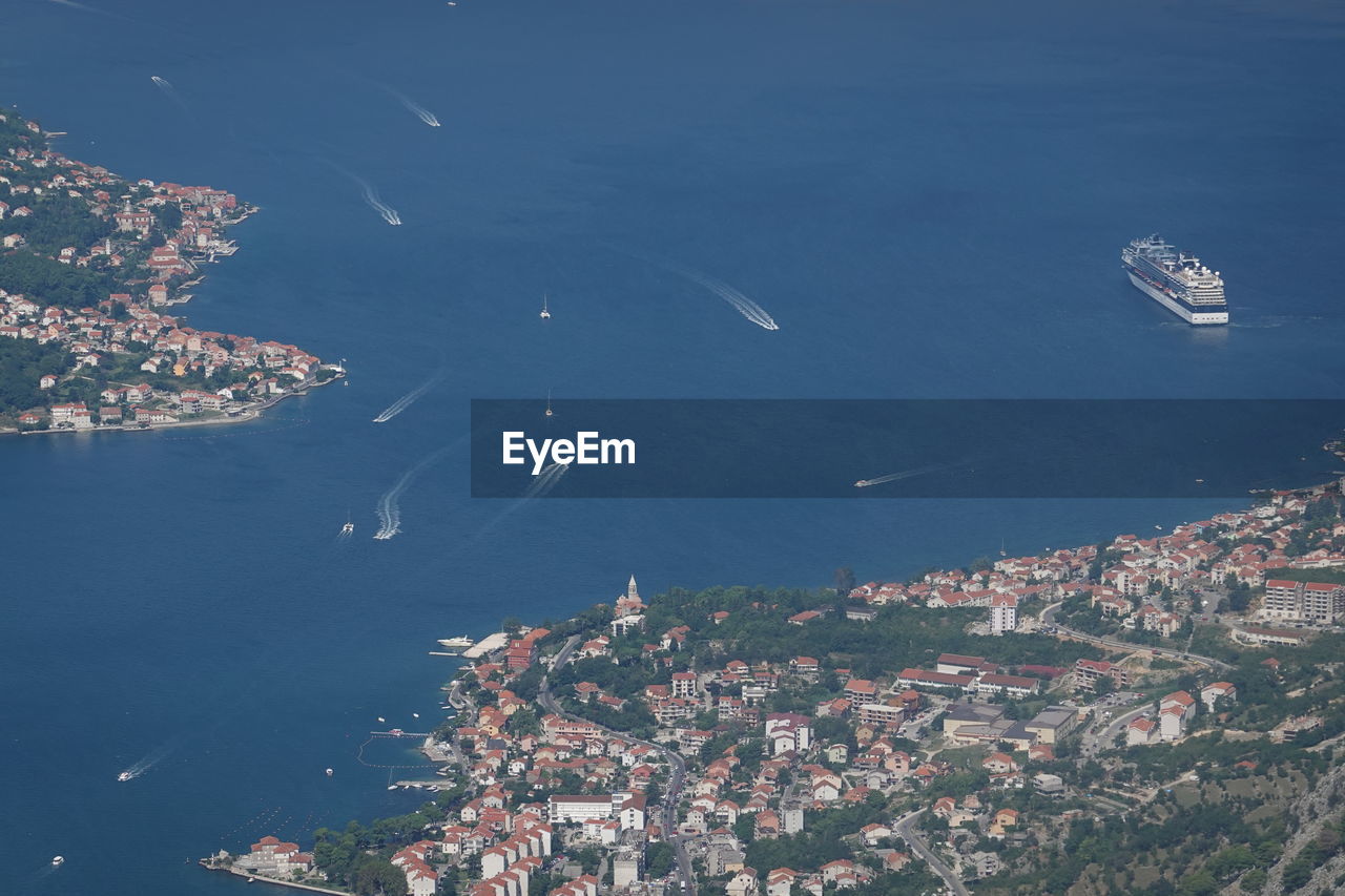 HIGH ANGLE VIEW OF BUILDINGS AND SEA