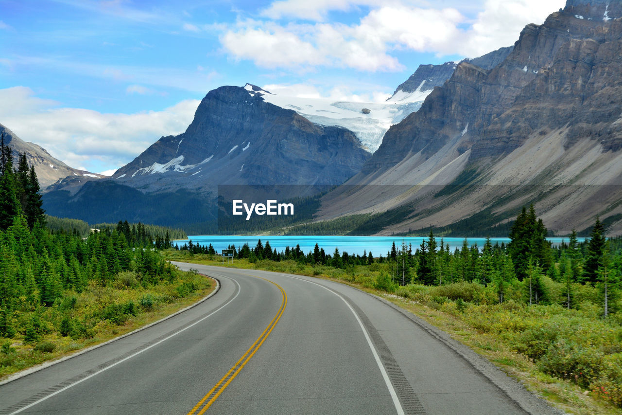 ROAD BY MOUNTAIN AGAINST SKY