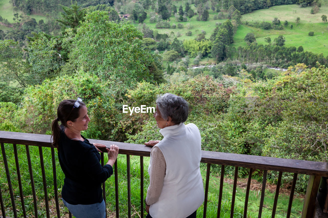 Senior mother and adult daughter traveling at the  view point over the cocora valley at salento