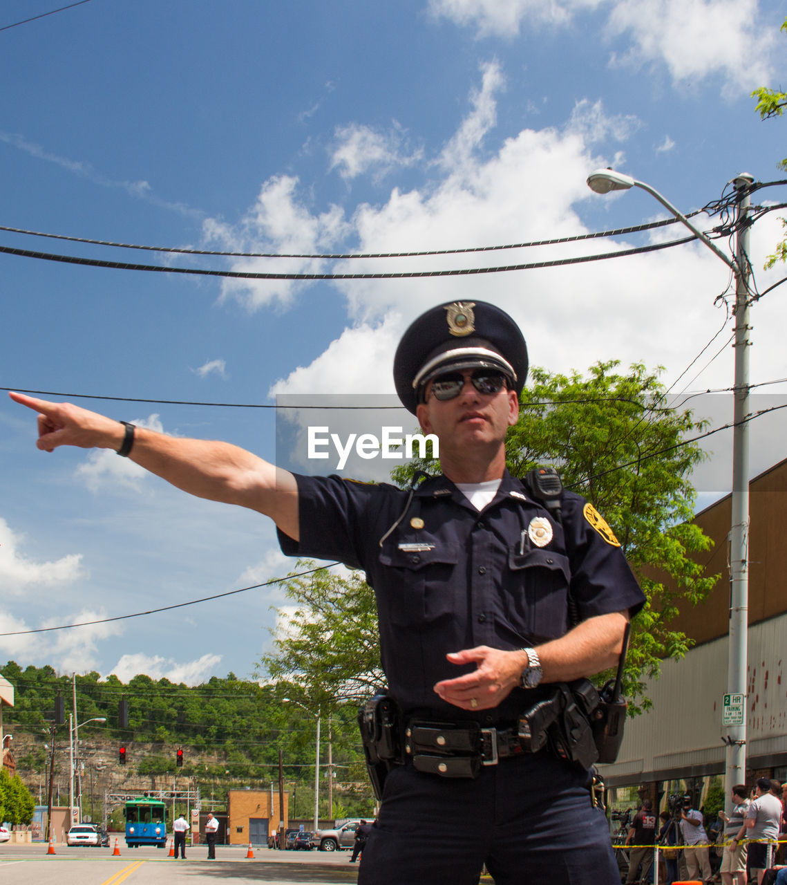 MAN STANDING ON CAMERA