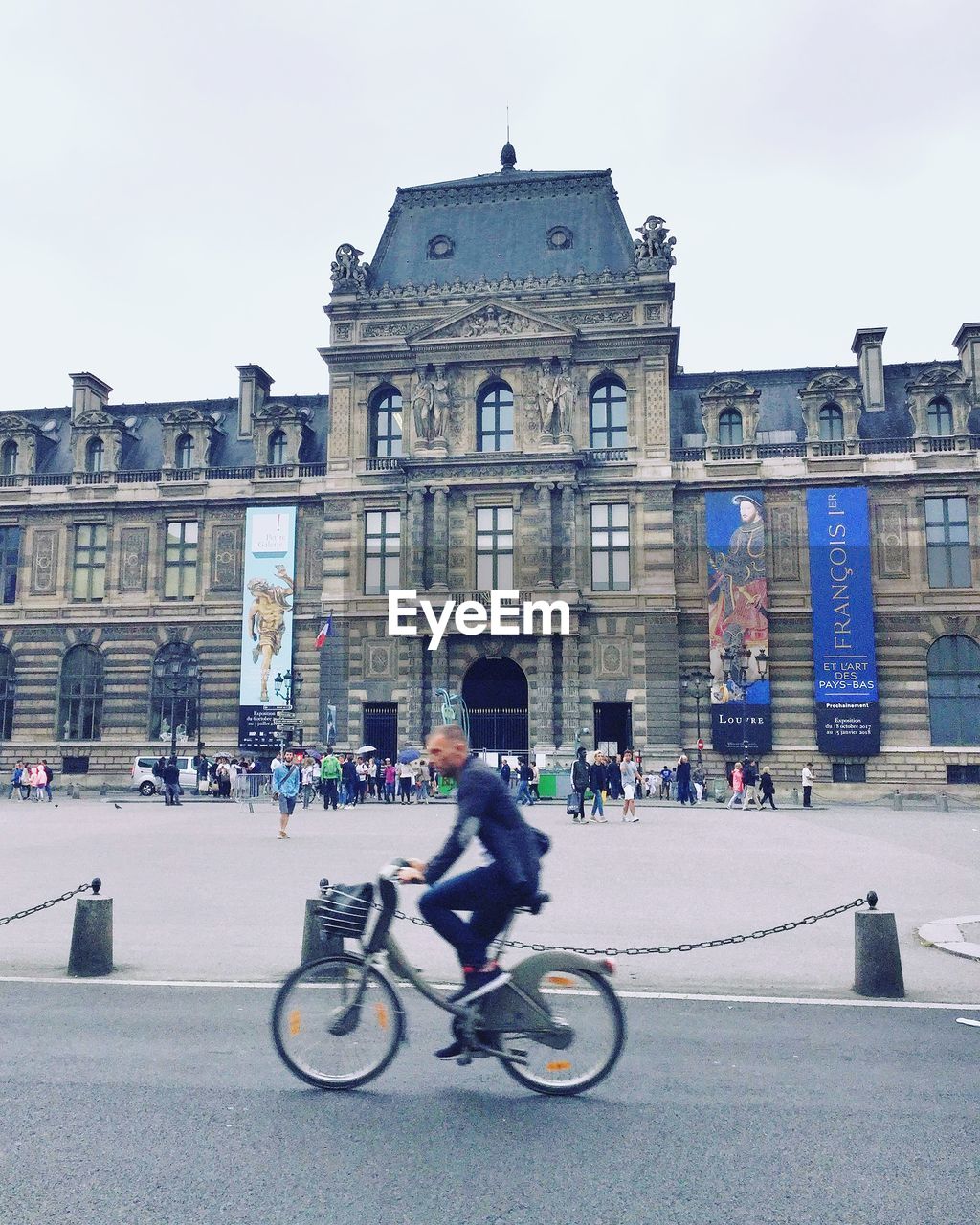 PEOPLE RIDING BICYCLE ON A CITY