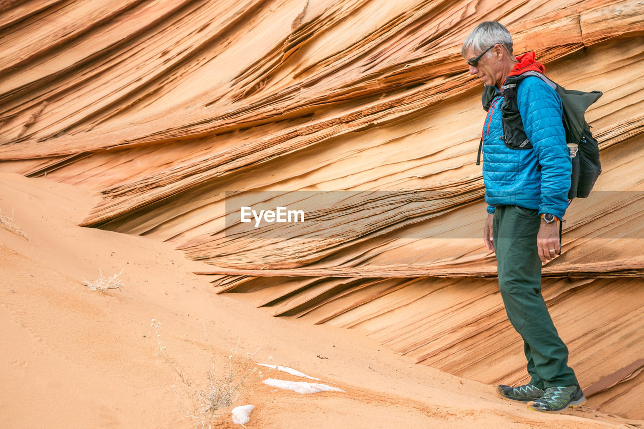 Man and lace rock in vermilion cliffs, south coyote buttes