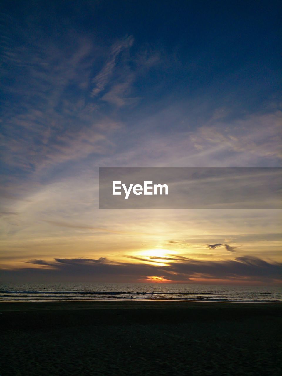 View of beach at sunset