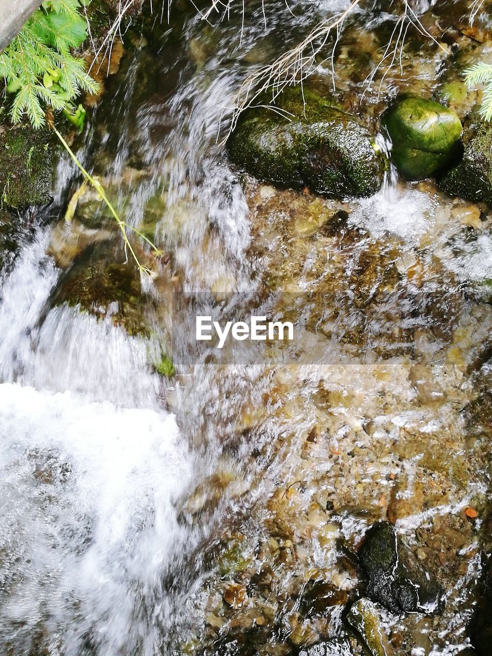 WATER FLOWING THROUGH ROCKS