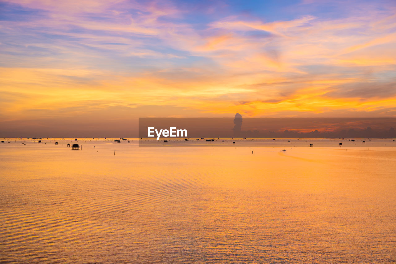 Scenic view of sea against orange sky