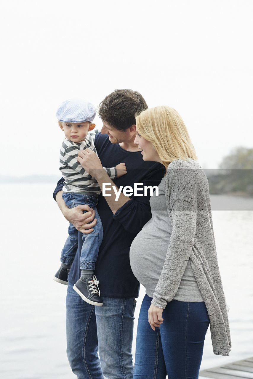 Family with son on jetty