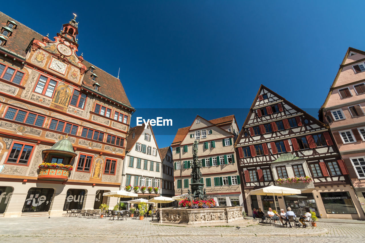 LOW ANGLE VIEW OF BUILDINGS IN TOWN