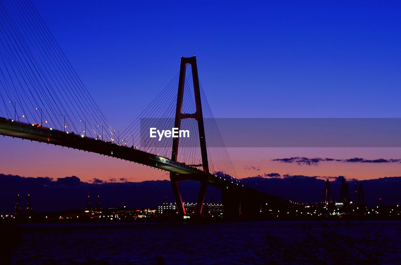 View of suspension bridge at night