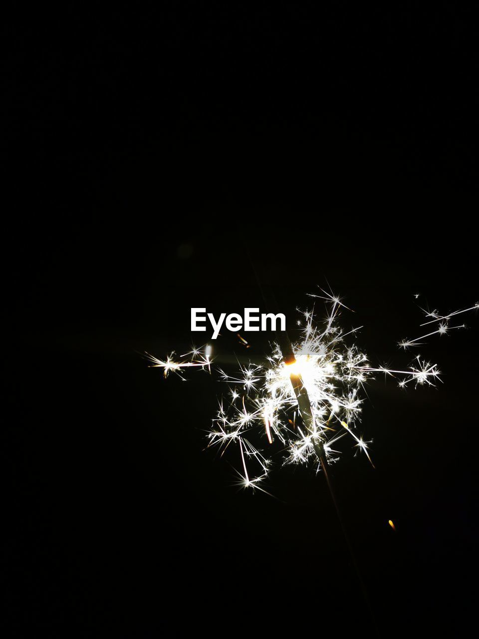 CLOSE-UP OF FIREWORK DISPLAY AT NIGHT