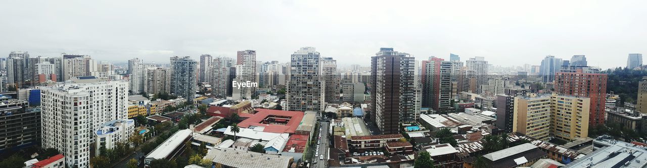 Panoramic view of cityscape against clear sky