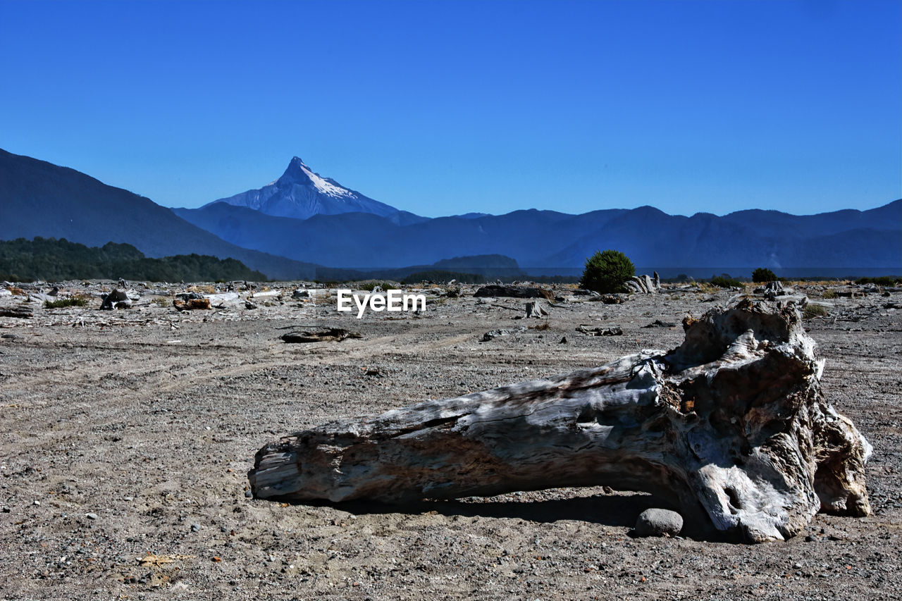 SCENIC VIEW OF LAND AGAINST CLEAR BLUE SKY