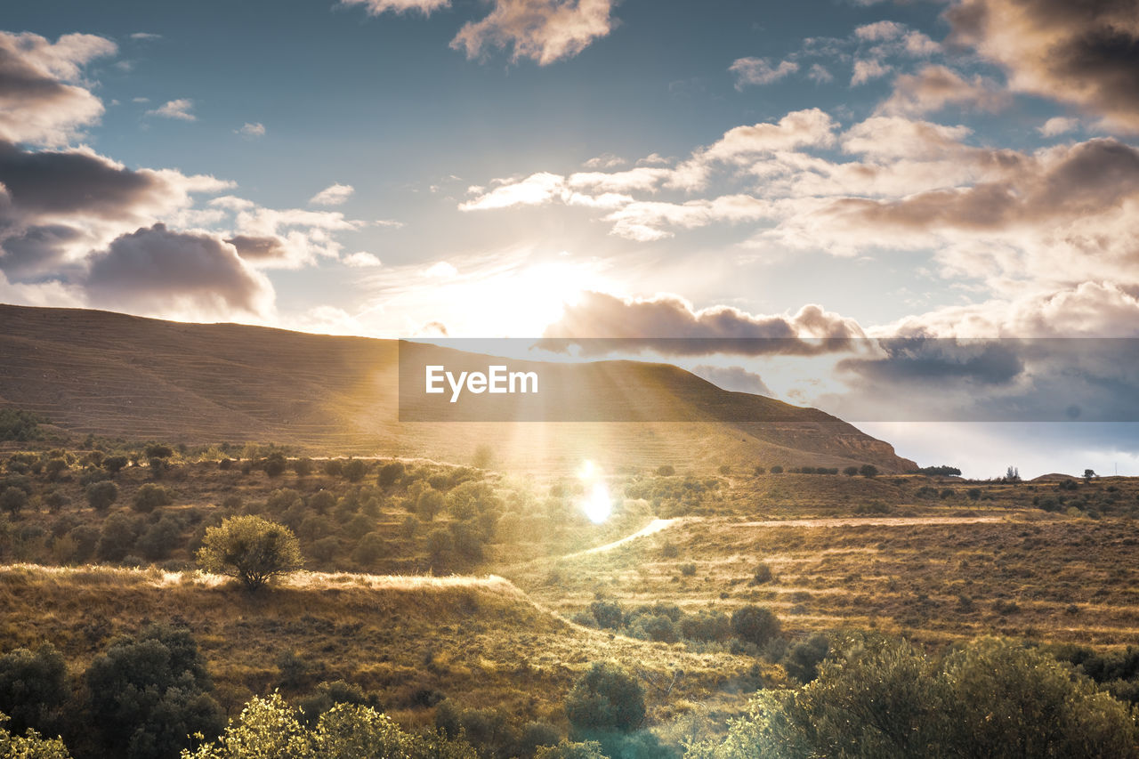 Scenic view of landscape against sky during sunset