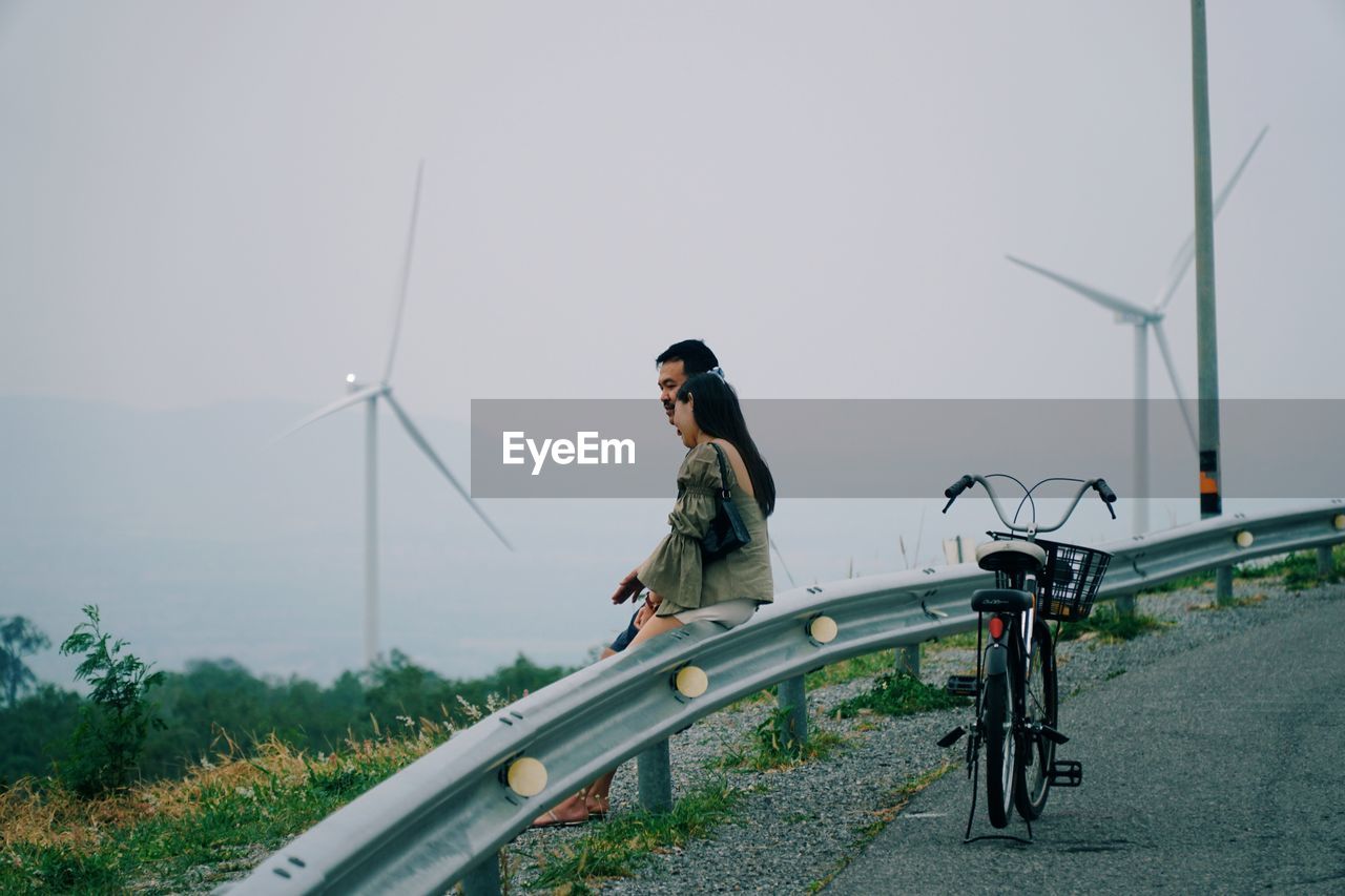 Man on bicycle against clear sky