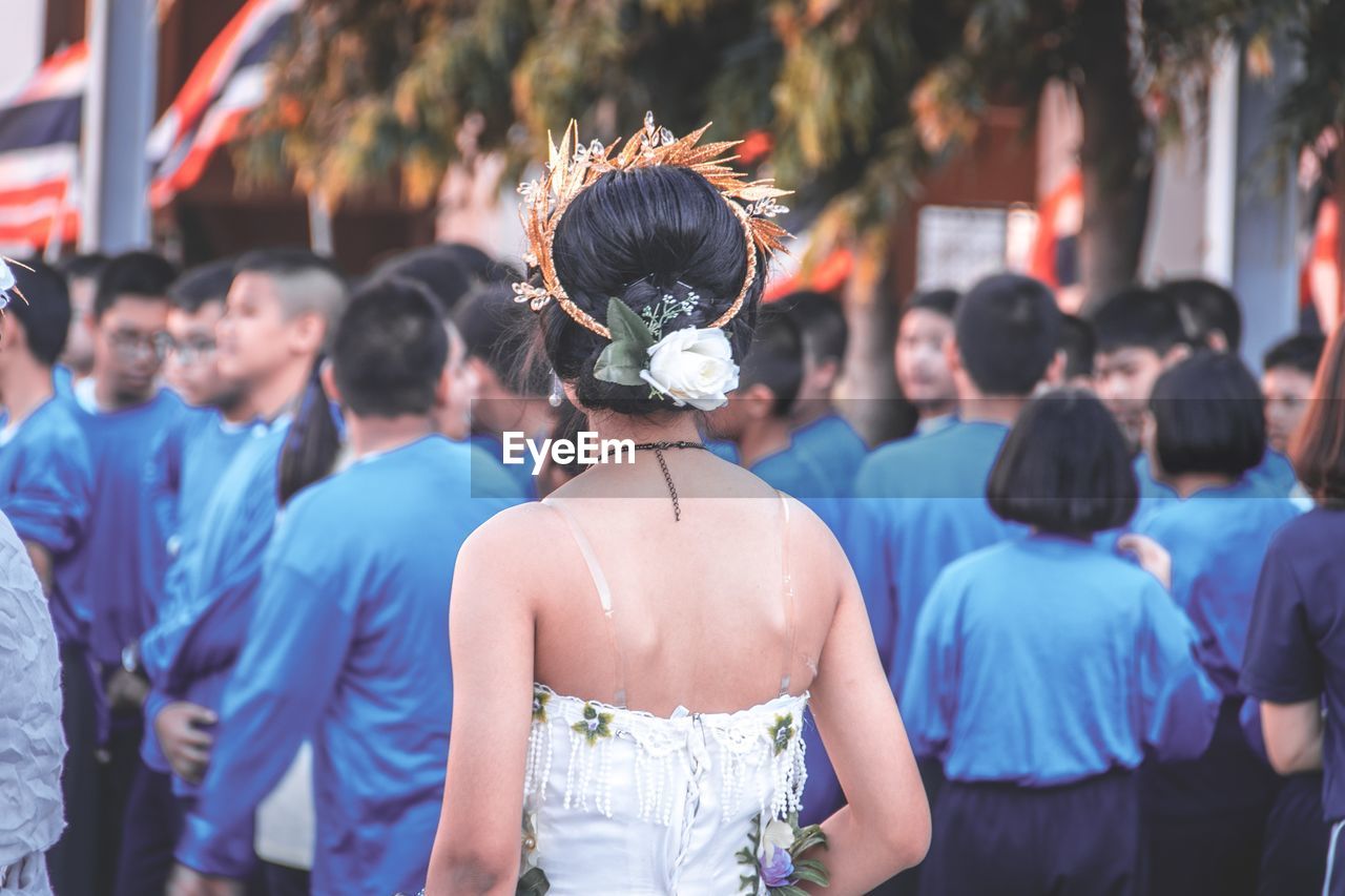 Girl wearing tiara with friends during celebration