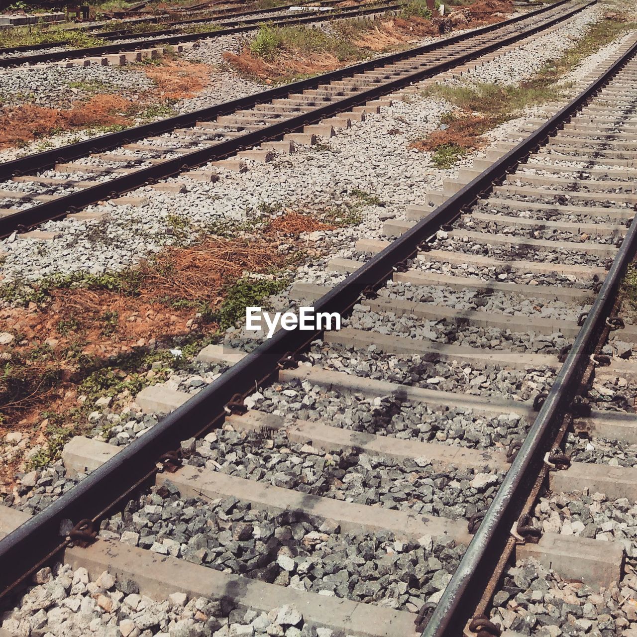 HIGH ANGLE VIEW OF RAILROAD TRACK BY TRACKS