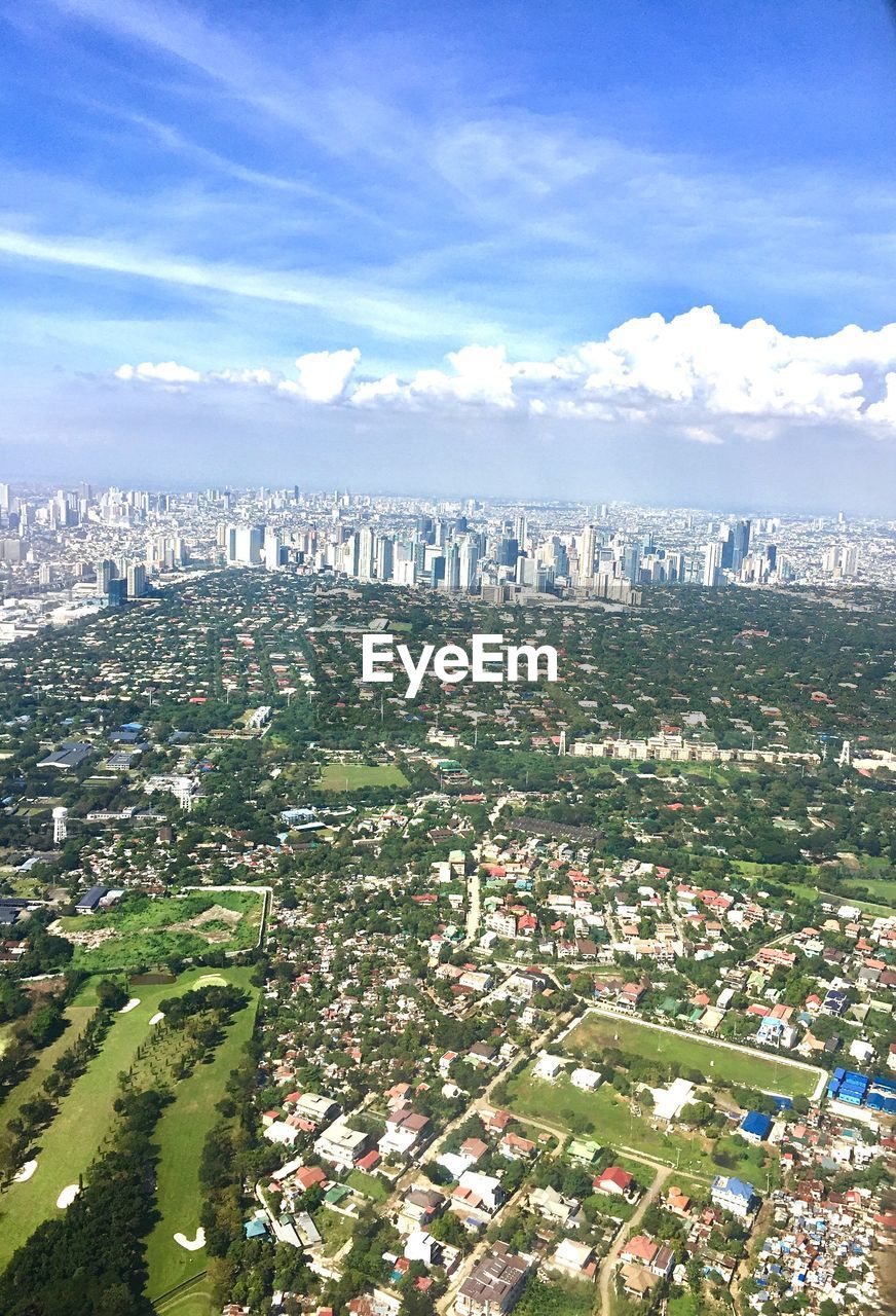 High angle view of city buildings against sky