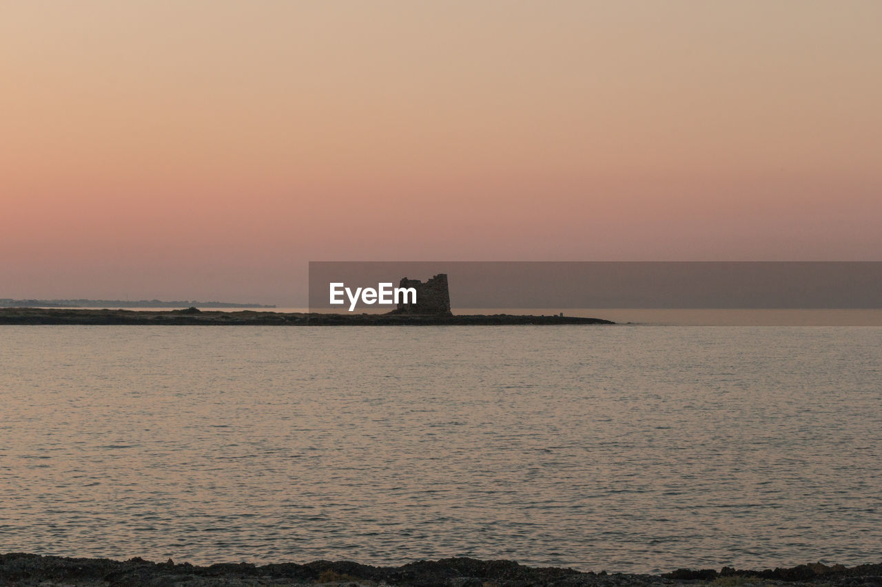 SCENIC VIEW OF SEA DURING SUNSET