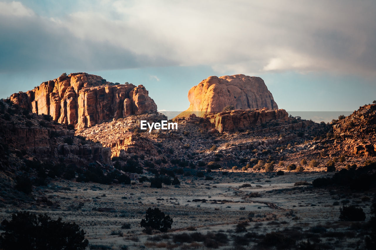 Rock formation on land against sky