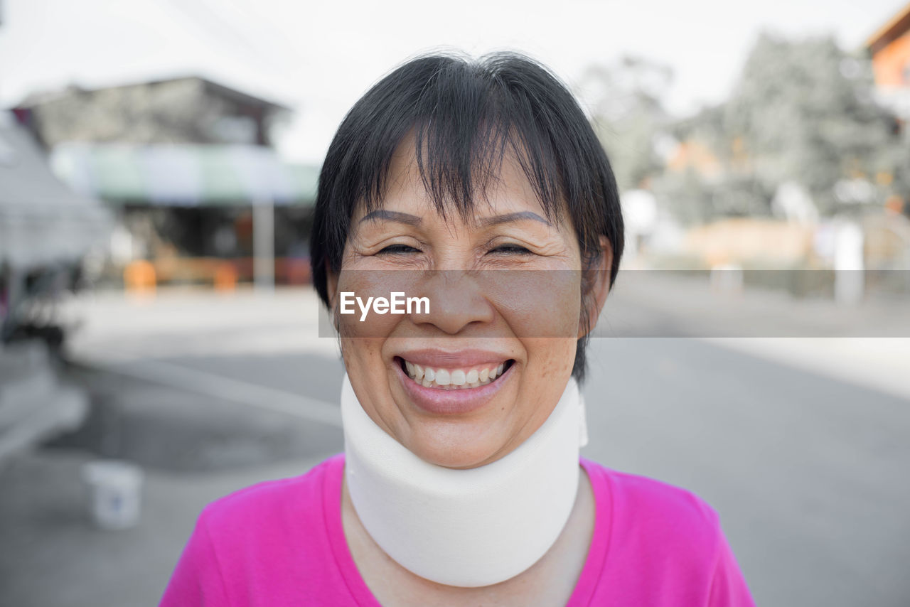 Portrait of woman wearing cervical neck collar