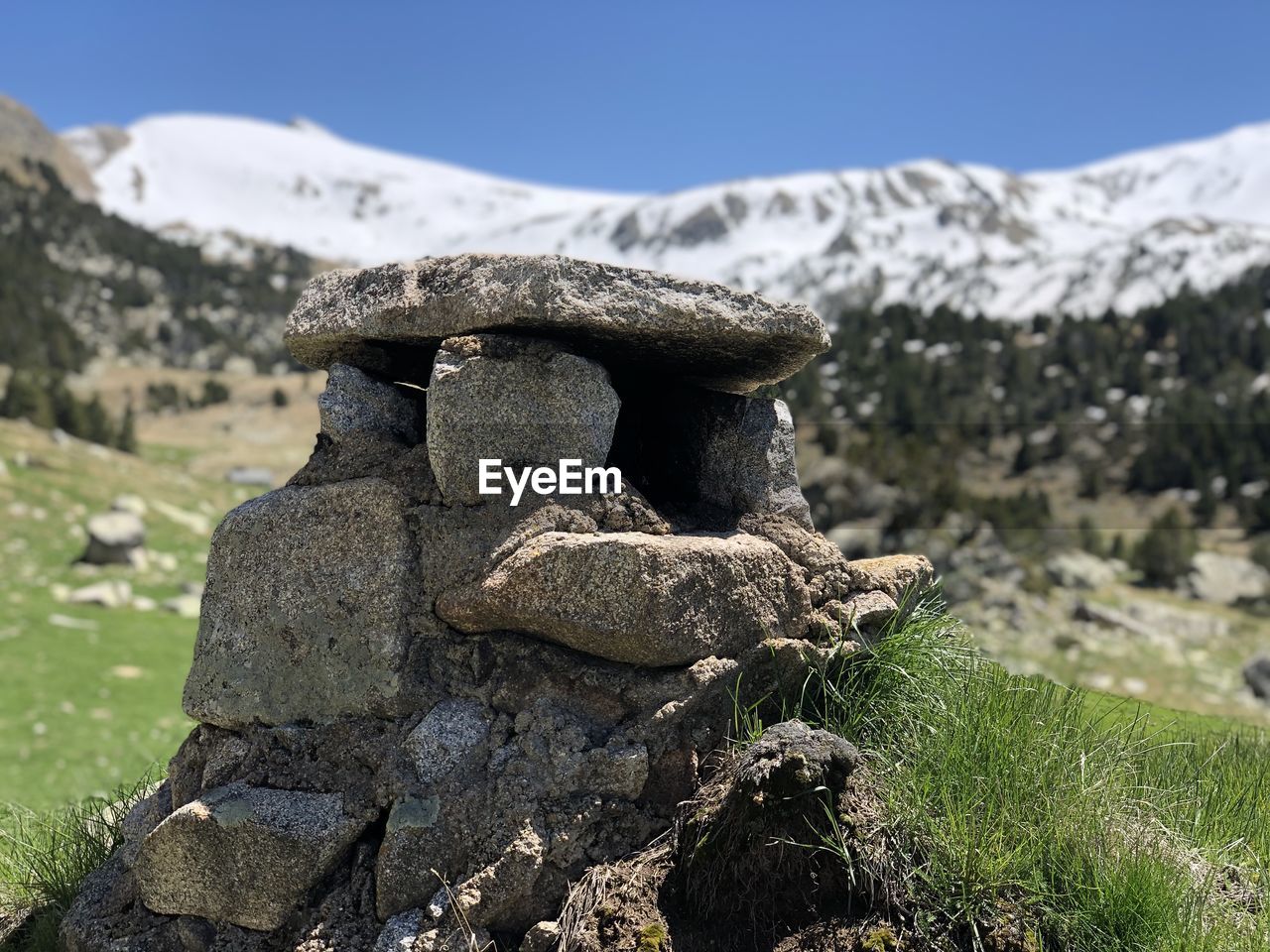 Close-up of chimney tower built of stone stack on rock