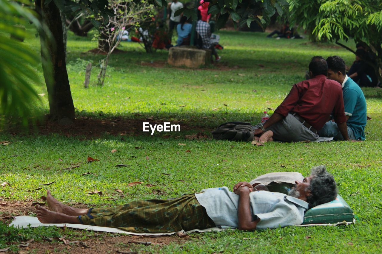 Full length of man relaxing in park