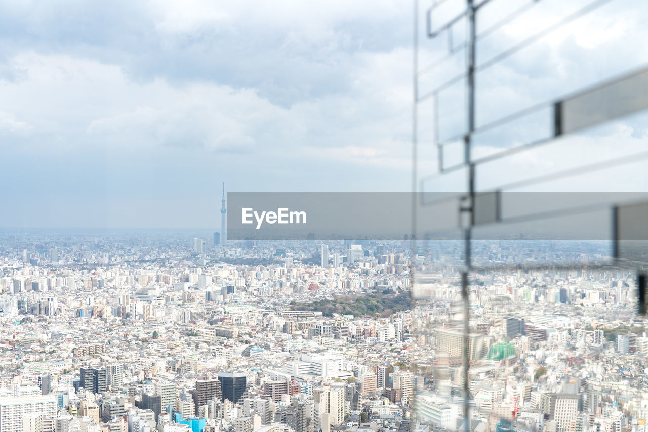 HIGH ANGLE VIEW OF BUILDINGS AGAINST SKY