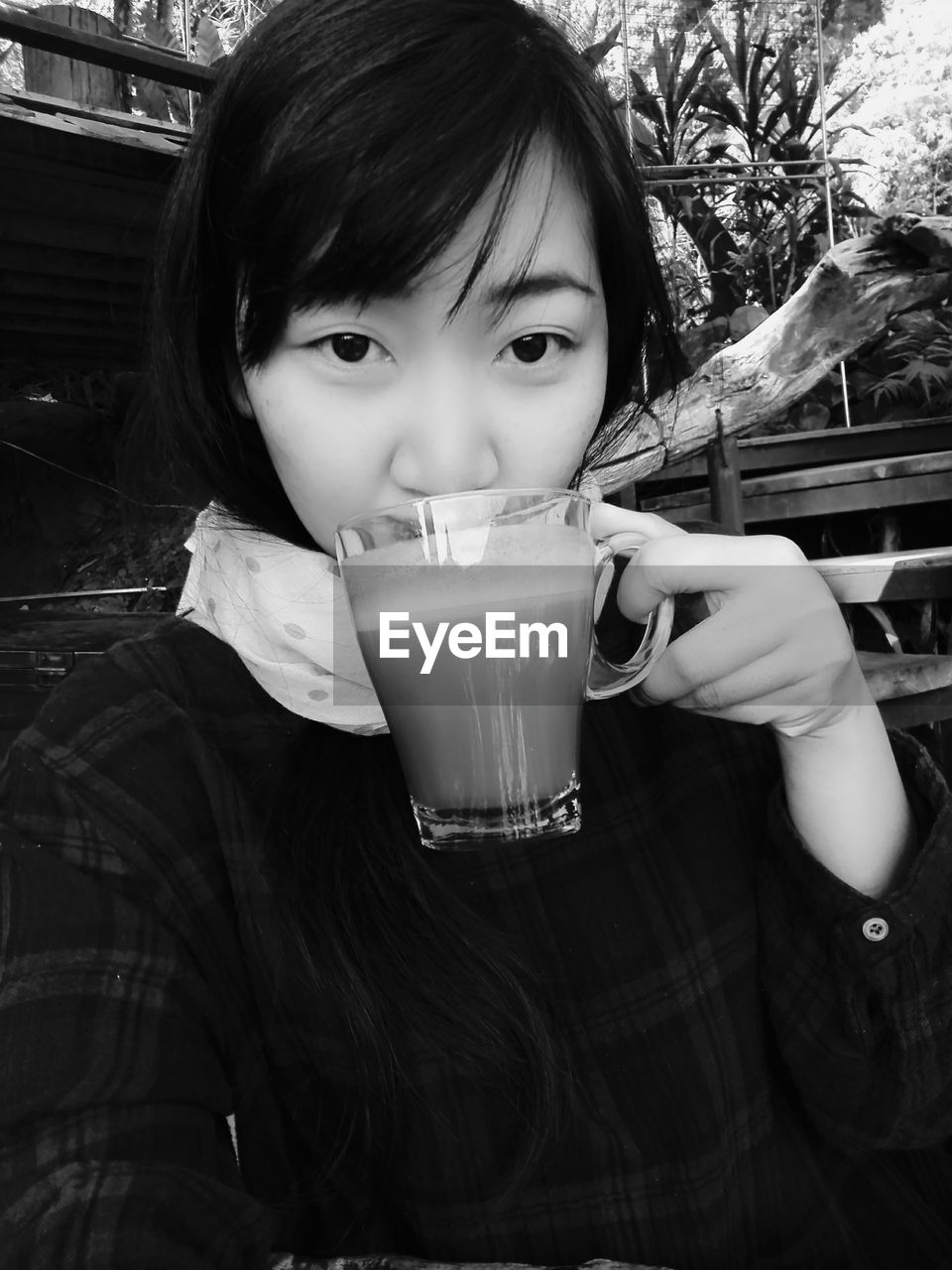 CLOSE-UP PORTRAIT OF A GIRL DRINKING FROM A DRINK