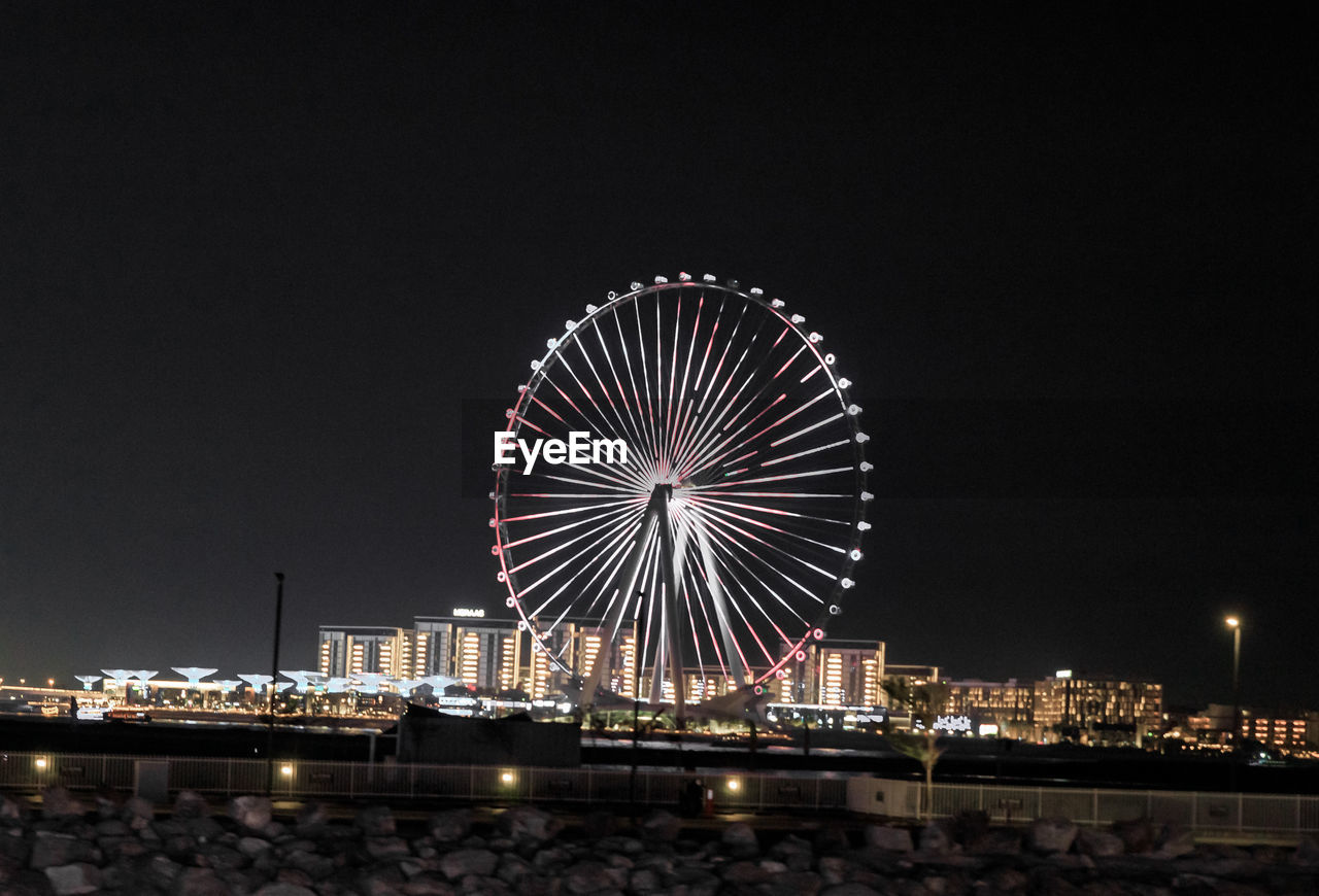 low angle view of illuminated city at night