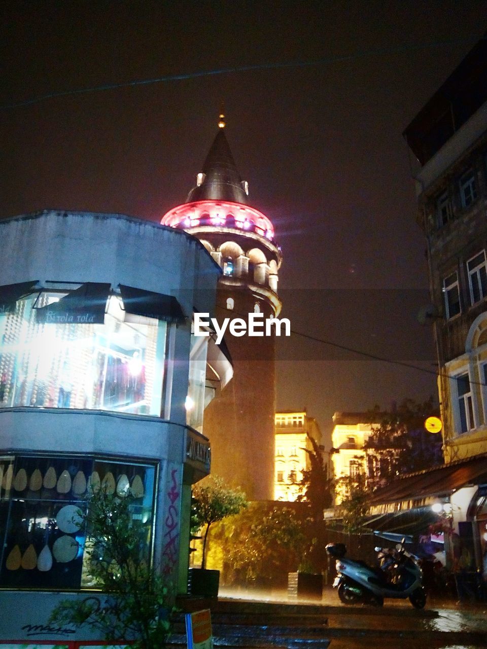 Low angle view of illuminated built structures against sky