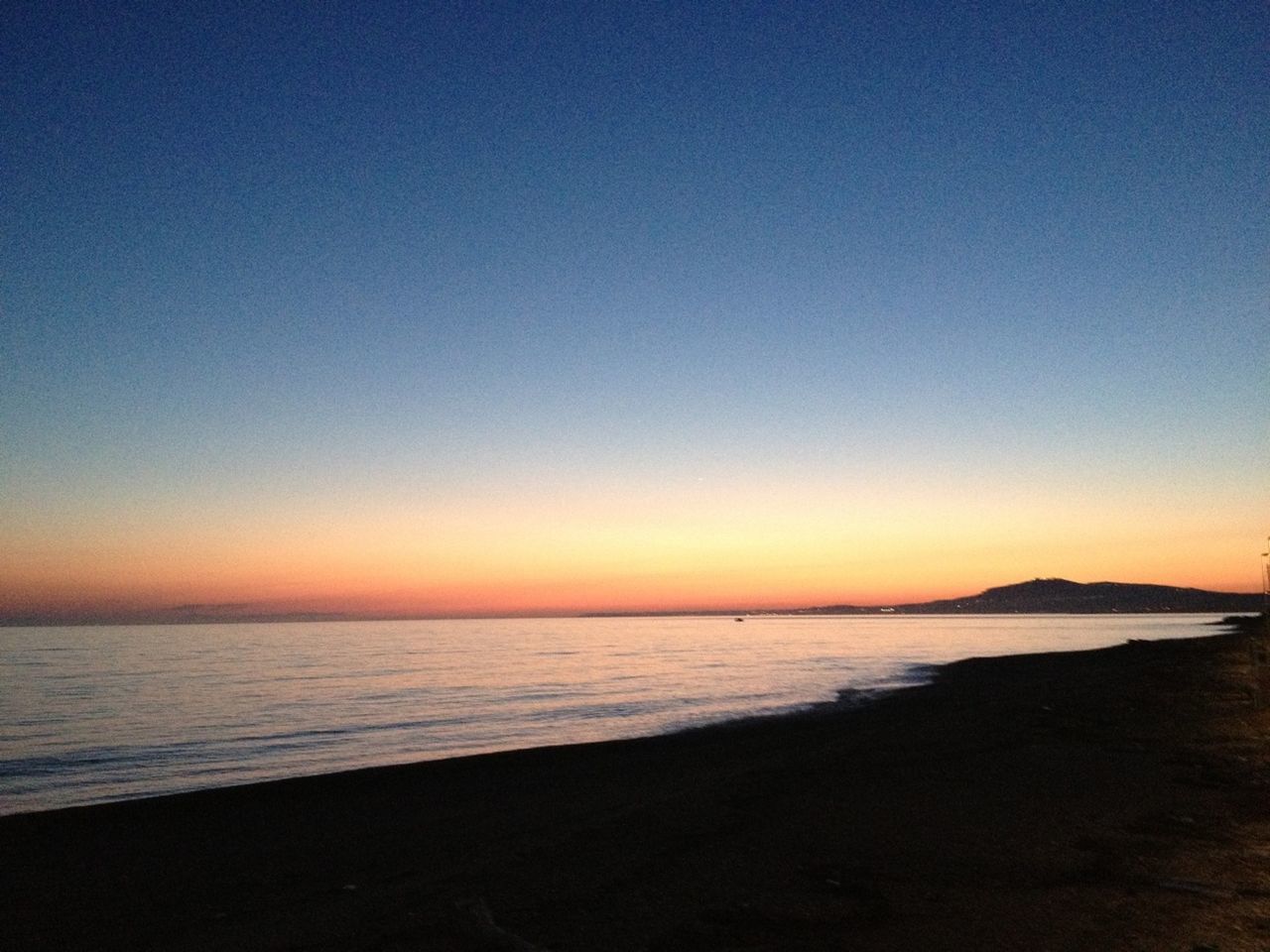 VIEW OF SEA AT SUNSET