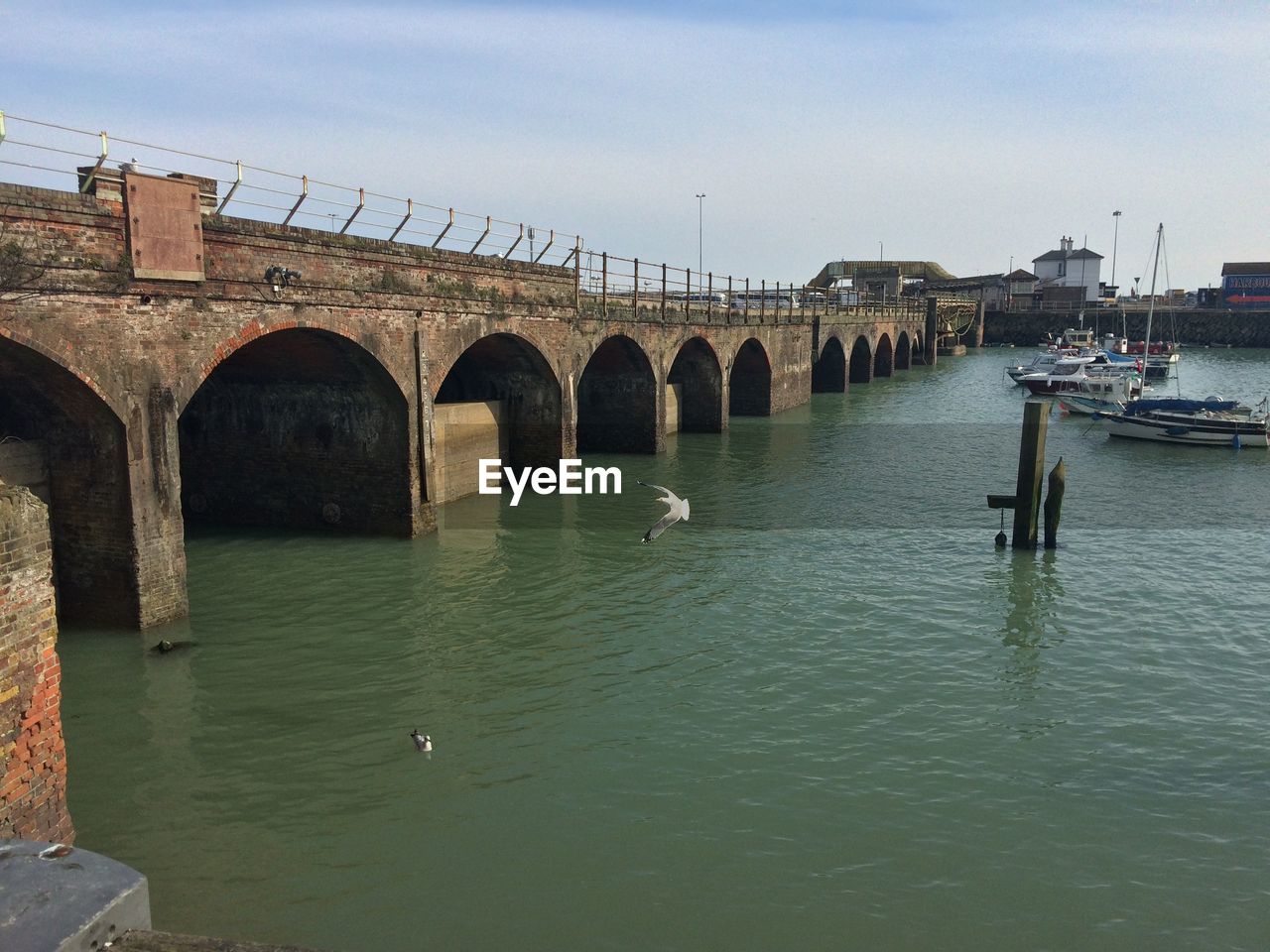 VIEW OF BRIDGE OVER RIVER AGAINST SKY