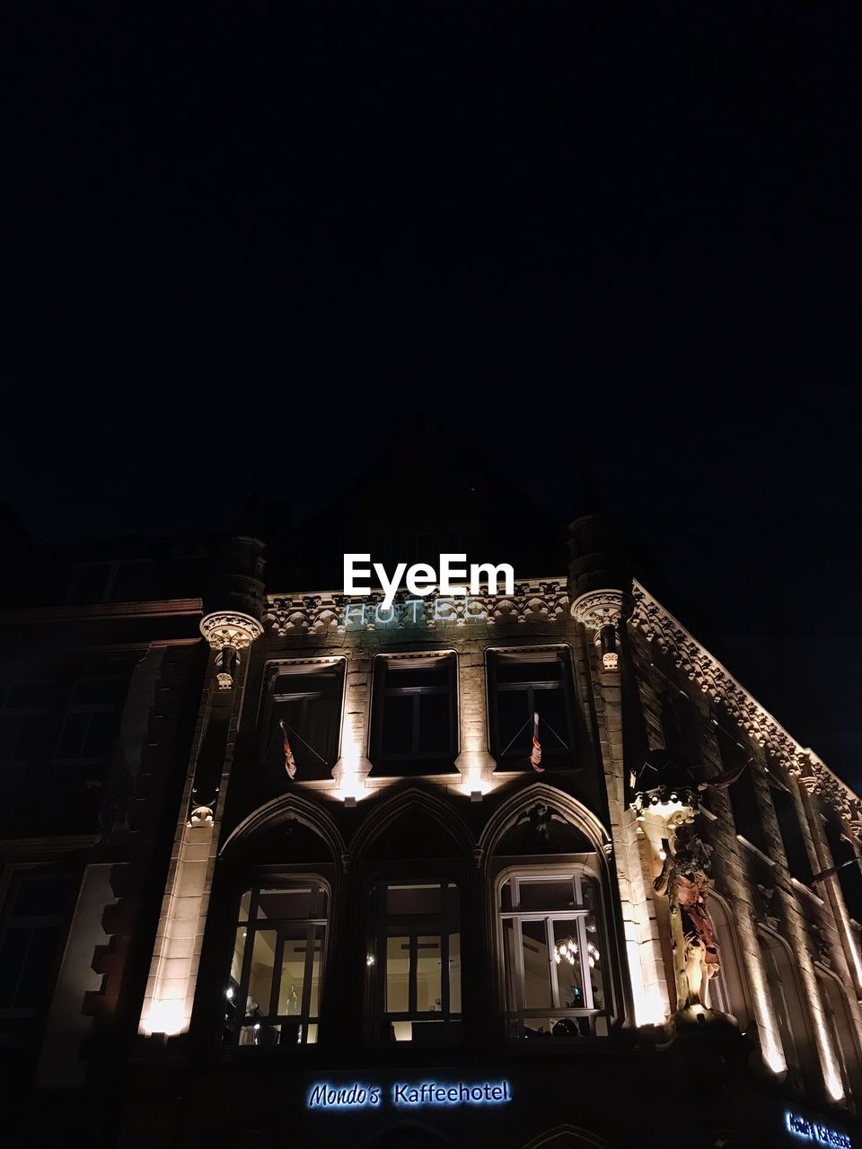 LOW ANGLE VIEW OF ILLUMINATED BUILDING